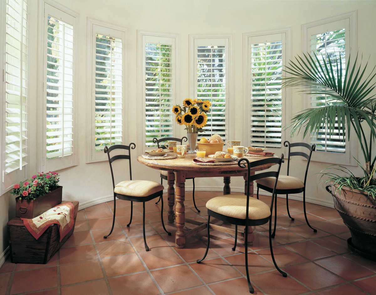 Custom dining room window treatments for homes near Greenville, South Carolina (SC) like custom wood shutters.